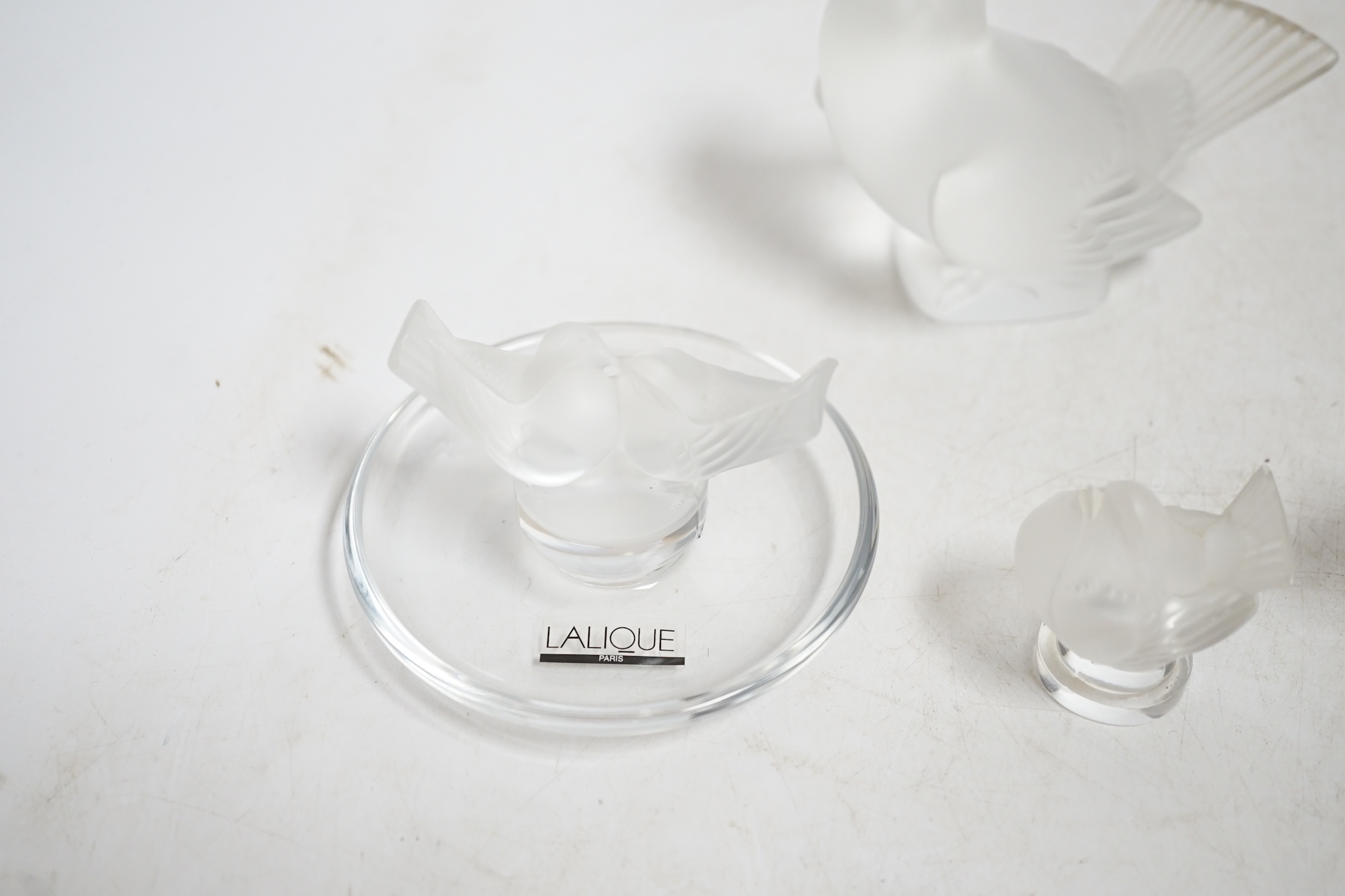 Three modern Lalique glass birds and a similar Lalique dish, each signed, largest 13.5cm wide. Condition - good